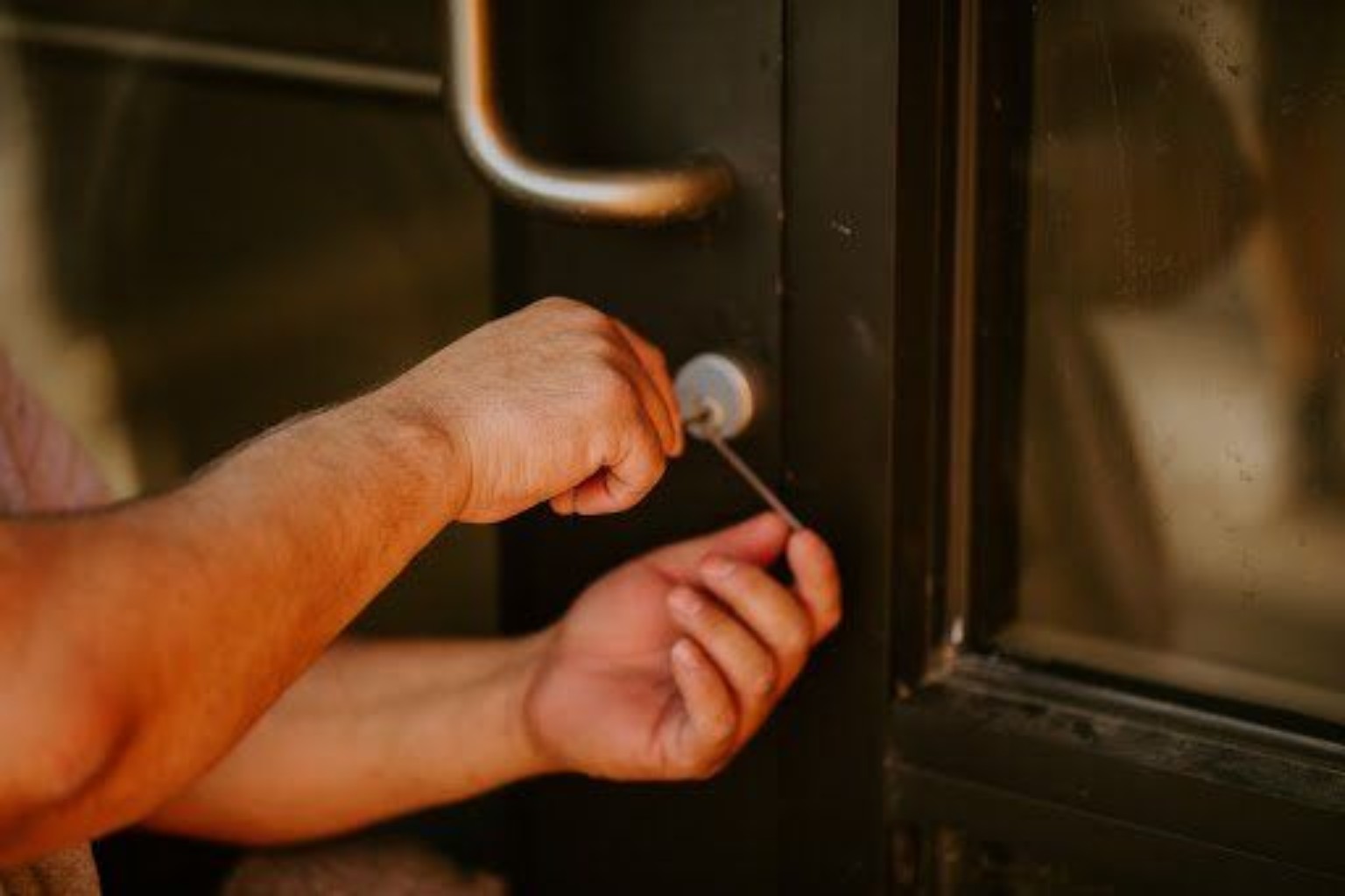 APD Locksmith working on a commercial door lock